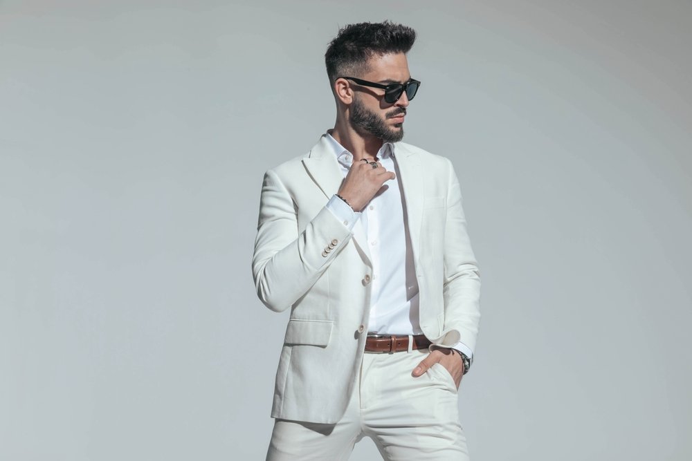 Bearded,Man,Adjusting,Open,Collar,Shirt,,Wearing,White,Suit,For
